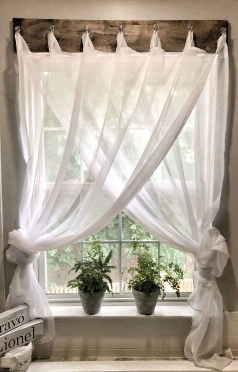 Struggling with window treatments? I needed a simple farmhouse window treatment for my bathroom. Check out how I came up with this inexpensive solution.