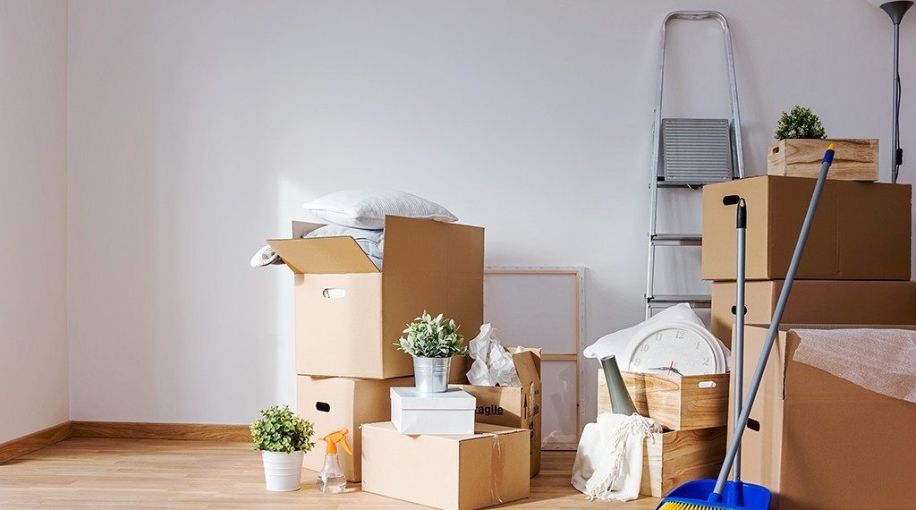Move. Cardboard boxes and cleaning things for moving into a new home